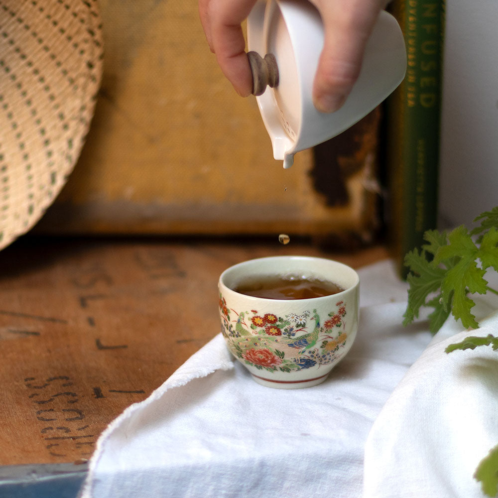 pouring milk into a mug of our New Zealand Waikato Black tea