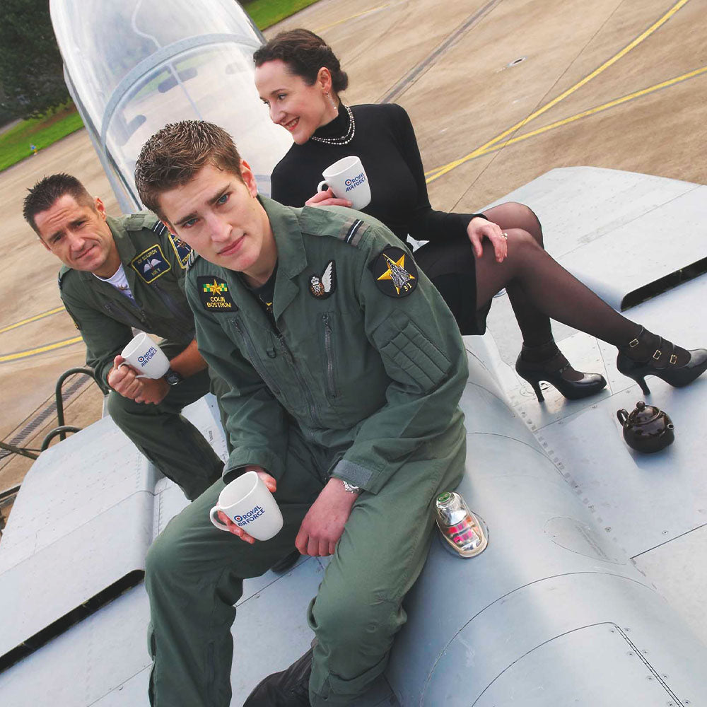 image of 3 people drinking the RAF tea for heroes on while sitting on an RAF plane