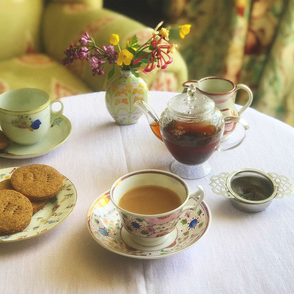 afternoon tea table with a jug of Rare Afternoon Tea in the centre
