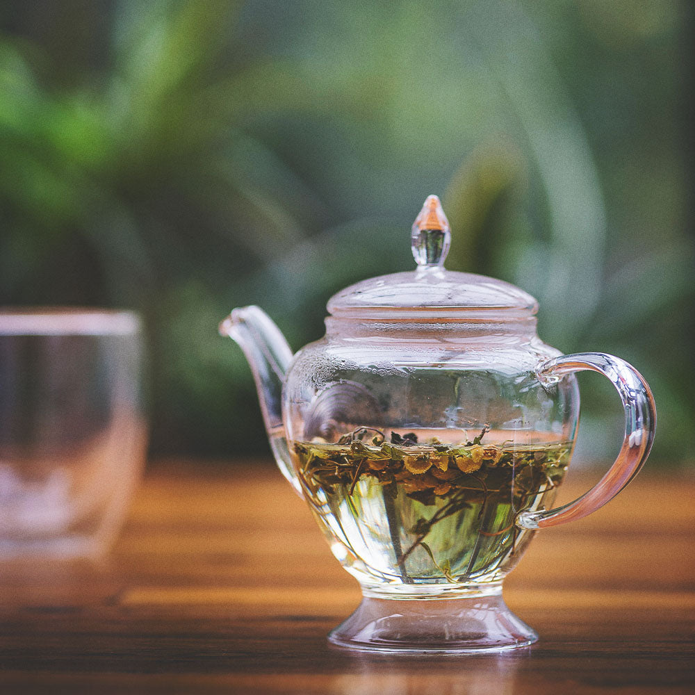 glass jug of Soothe-Me Tea steeping