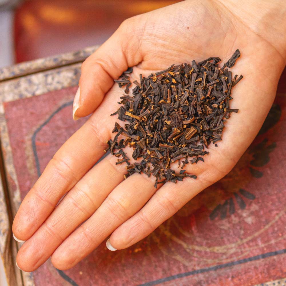 person holding a portion of our Sri Lankan Vanilla Tea in their hand