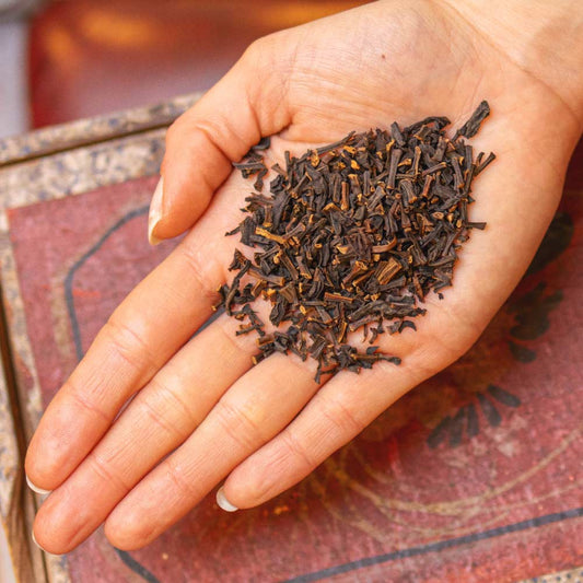 person holding a portion of our Sri Lankan Vanilla Tea in their hand