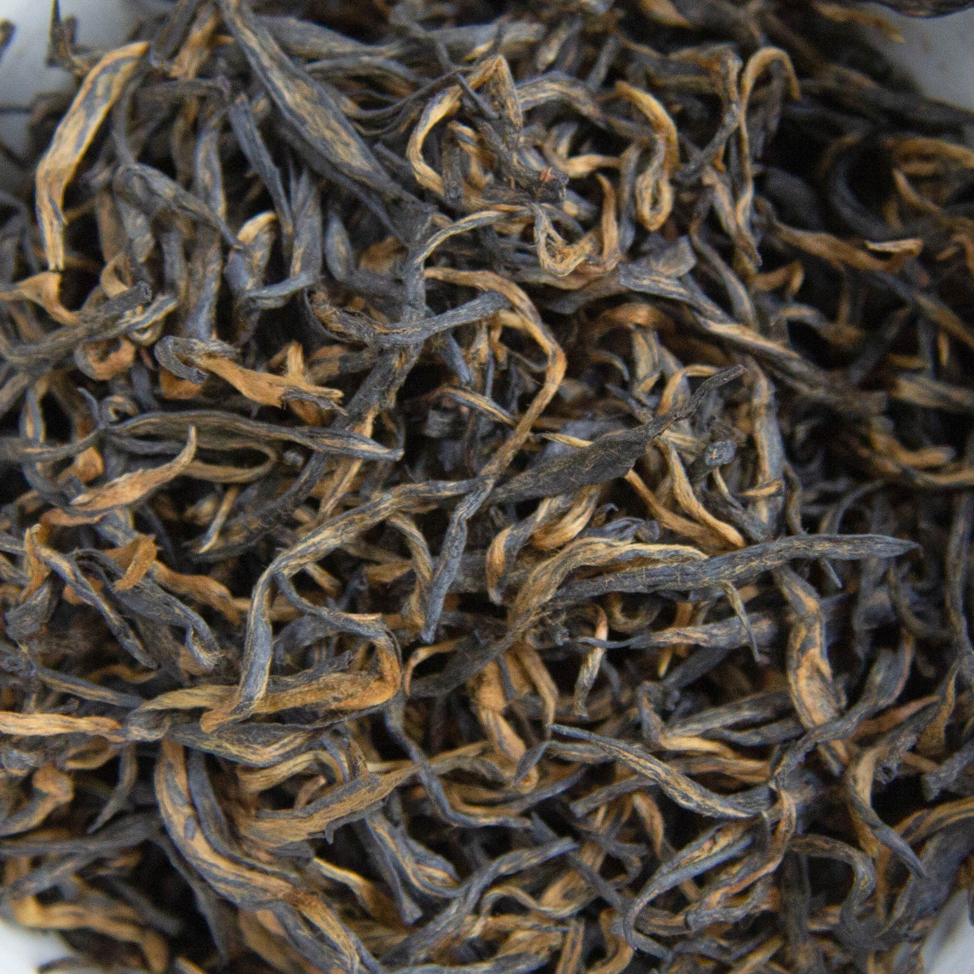 close up of our Extremely Rare Chinese Emperor's Golden Eyebrow tea leaves