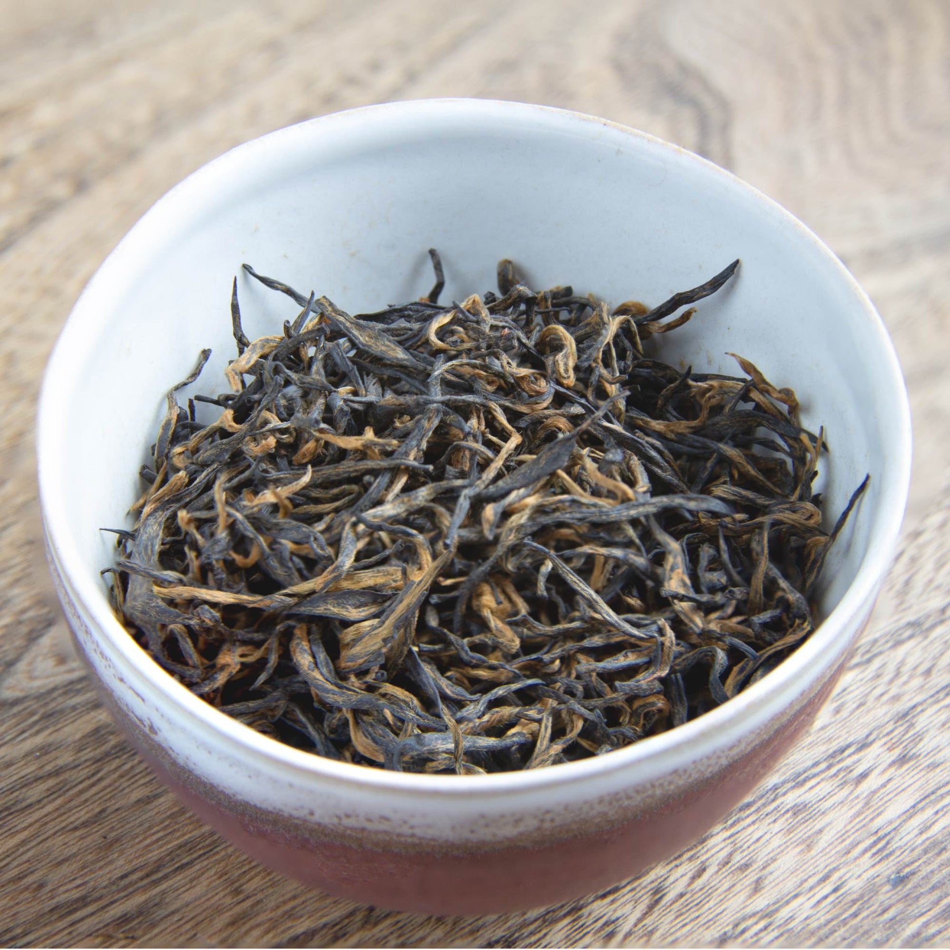bowl of leaves of our Extremely Rare Chinese Emperor's Golden Eyebrow tea