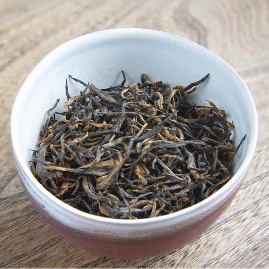 bowl of leaves of our Extremely Rare Chinese Emperor's Golden Eyebrow tea