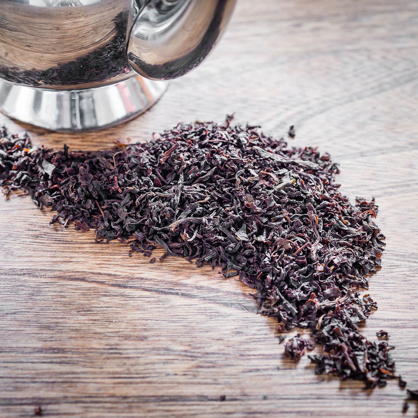 individual leaves of Single Estate Lost Malawi English Breakfast tea on a table