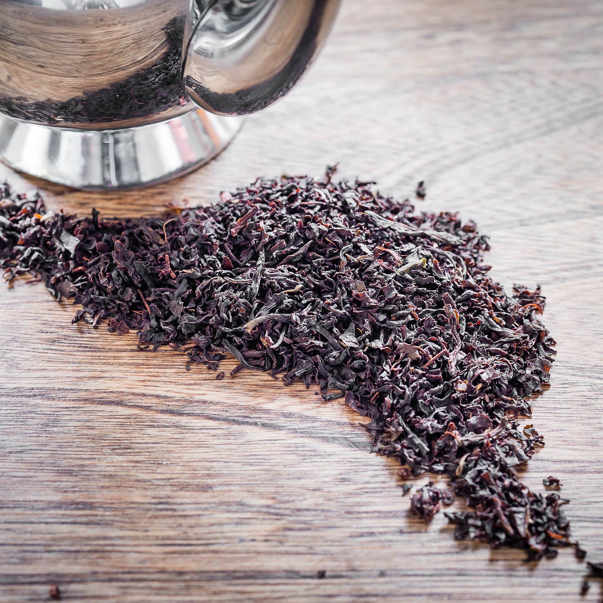 individual leaves of Single Estate Lost Malawi English Breakfast tea on a table