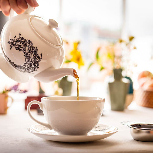 pouring a mug of Rare English Breakfast tea from a teapot